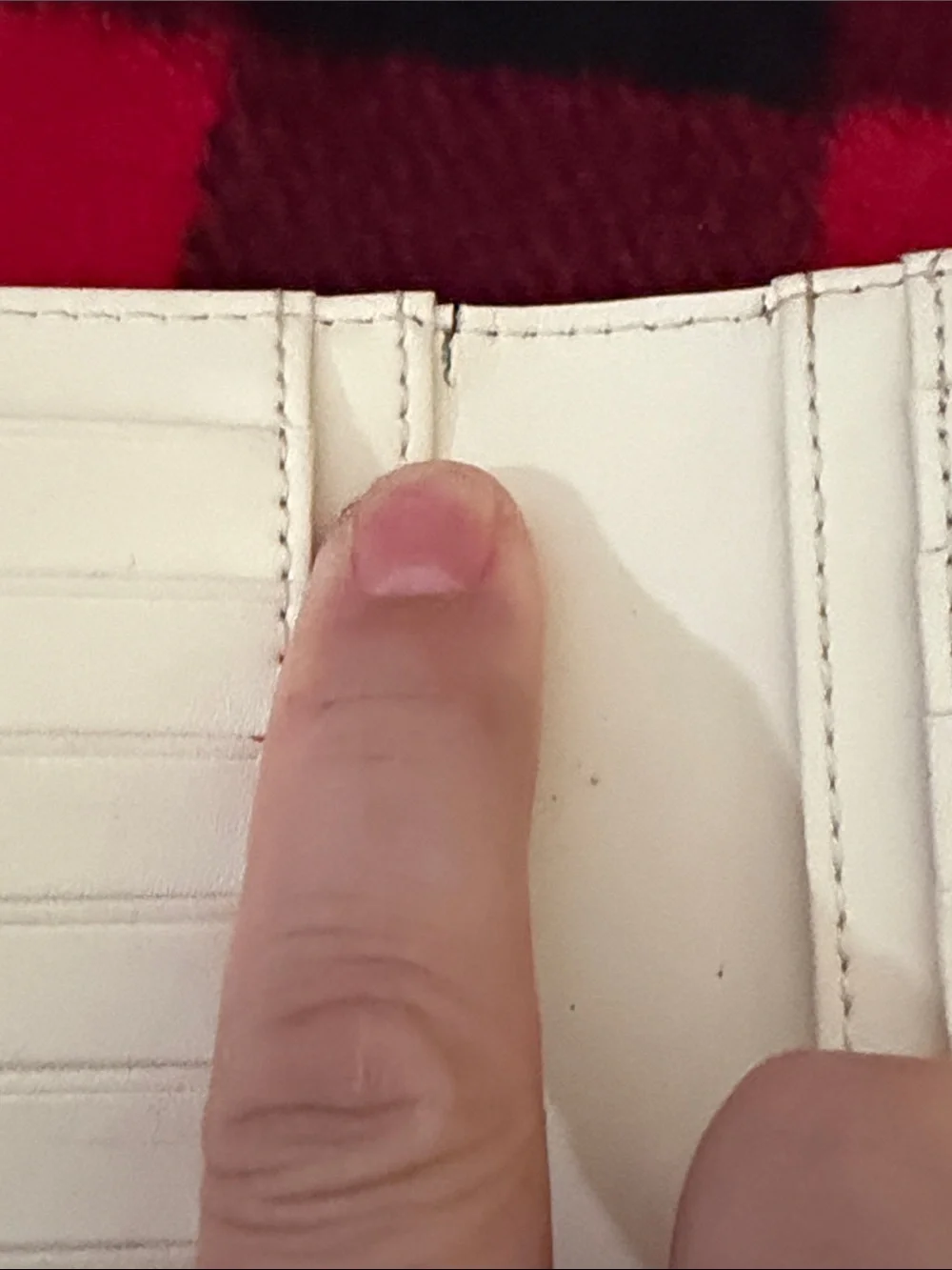 Kate Spade New York Staci large slim bifold wallet in a red currant shade